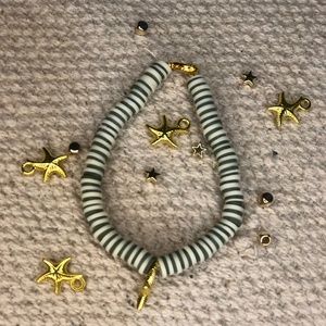 Green, white and gold bracelet with gold starfish charm